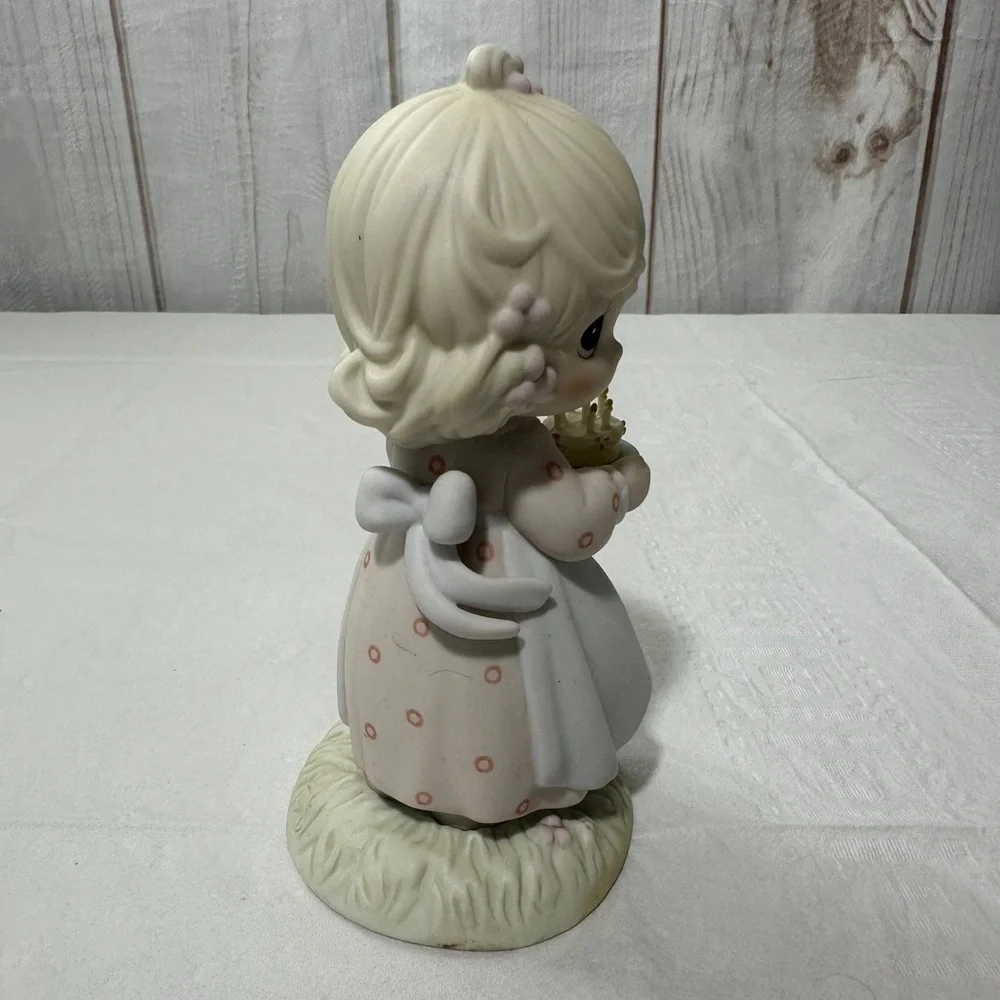 Precious Moment’s figurine titled “May Your Birthday Be A Blessing” from 1990